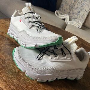 On Running White and Green Sneakers with Athletic Design